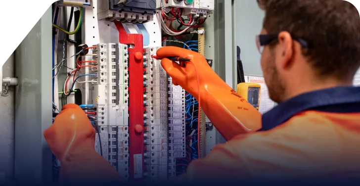 Electrician in Reno performing electrical panel maintenance, offering electrical services for businesses